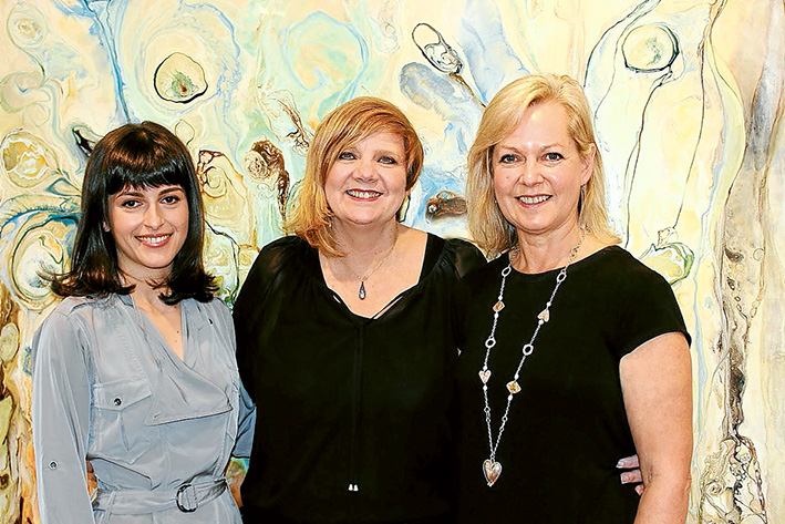 Arts inspired: Manyung Gallery has moved and expended, with “boutique” gallery at Mt Eliza Village, one for larger pieces at Mornington and spaces at Malvern and Sorrento. Working with the exhibitions are, from left, Irina Agaronyan (Malvern), co-director Sharyn Wemyss-Smith and Gillian Haig (Mt Eliza). Picture: Supplied