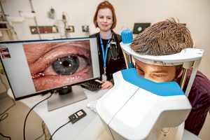 Sight seeing: Dr Sara MacKenzie watches on as Peninsula Health systems officer Terry Crossin looks at a new eyePressure device at Frankston Hospital. Picture: Yanni