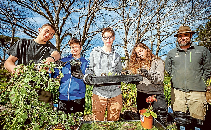 Cultural ties: The Briars hosted six French teenagers, among them Ninon Martin, Paul Pelletier, Slanislas (Stan) Brung and Romain Christophe, keen to help senior ranger Jarrod Ruche. Picture: Yanni
