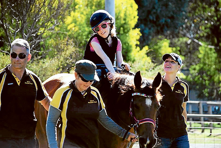 Along for the ride: Hayley Bennetts, 12, enjoying time in the saddle at a Riding for the Disabled Western Port ride.