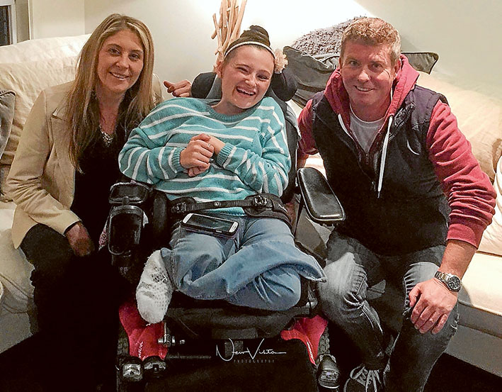 Fundraiser: Melissa and Maygan Garland with Glenn Browne, who is organising an event to raise money to buy a wheelchair lift.