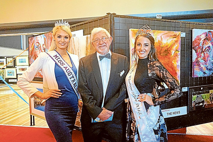Art event: Miss Australia International Jessica Martini and Miss Westernport Mikaela Fowler join art show chair John Renowden at last year’s opening.