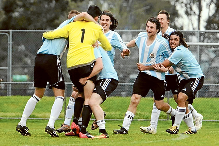 All Heart: Rosebud Heart goalkeeper Sean Skelly (No.1) is embraced by teammates following his two brilliant saves during the penalty shoot-out. Below: Heart players celebrate with the state championship win.