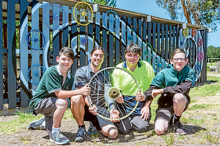 Bicycle network: Dylan, Miles, Jack and Matt demonstrate using bike wheels and rope how communities are connected to each other. Pictures: Gary Sissons