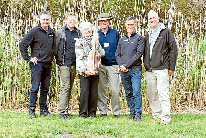 Linking habitats: Celebrating 30 years of Landcare are, from left, David Buntine, Ben Cullen, Bernie Schedvin, David Maddocks, James Fitzsimons and Doug Evans with an Australasian bittern palm frond creation.
