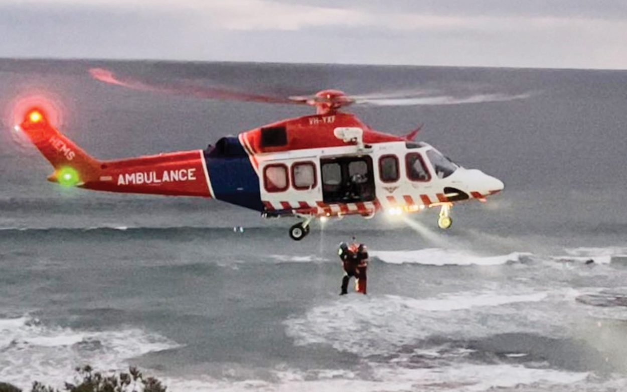 Airlift: A paraglider had a lucky escape when he hit trouble while gliding around Portsea on Saturday. Picture: Supplied